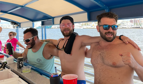 boys dancing on a bachelor party boat in charleston