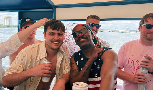 bros on the boat celebrating bachelor party