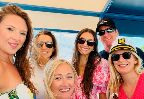 girls and captain on their parivate bachelorette cruise