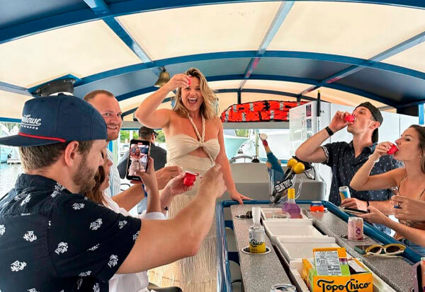 people playing shots game on a public party boat in charleston
