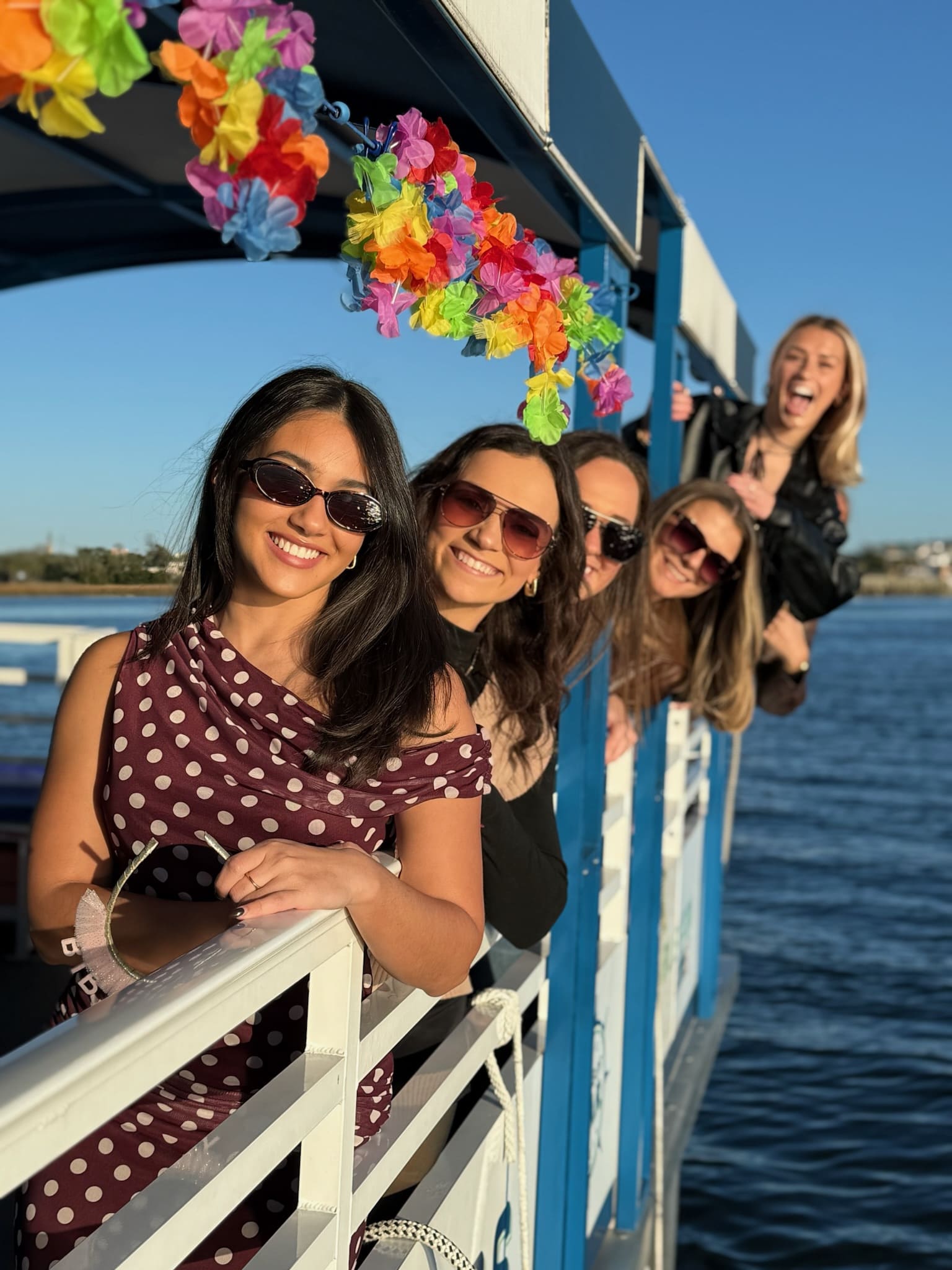 Group of friends aboard harbor bar during winter